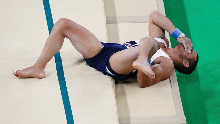 Samir Ait Said breaks his leg following a crash landing in his artistic gymnastics routine.