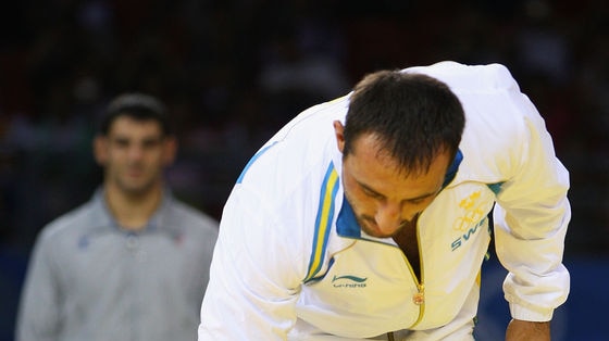 Ara Abrahamian of Sweden leaves the podium immediately after receiving the bronze medal