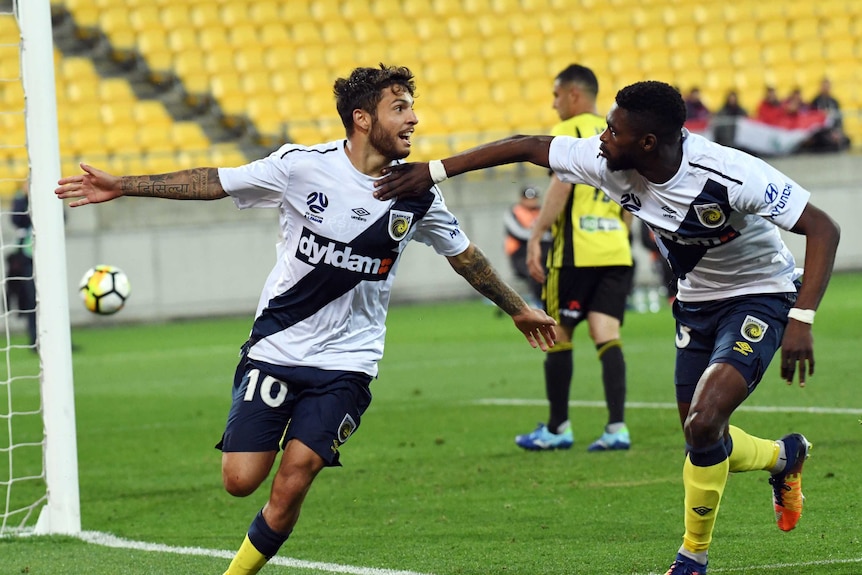 Daniel de Silva (L) scores a goal for the Mariners against Wellington Phoenix.