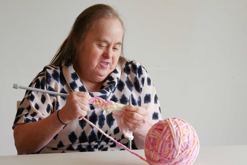 Heather Styles tries her hand at knitting in the New Horizon Club's craft class