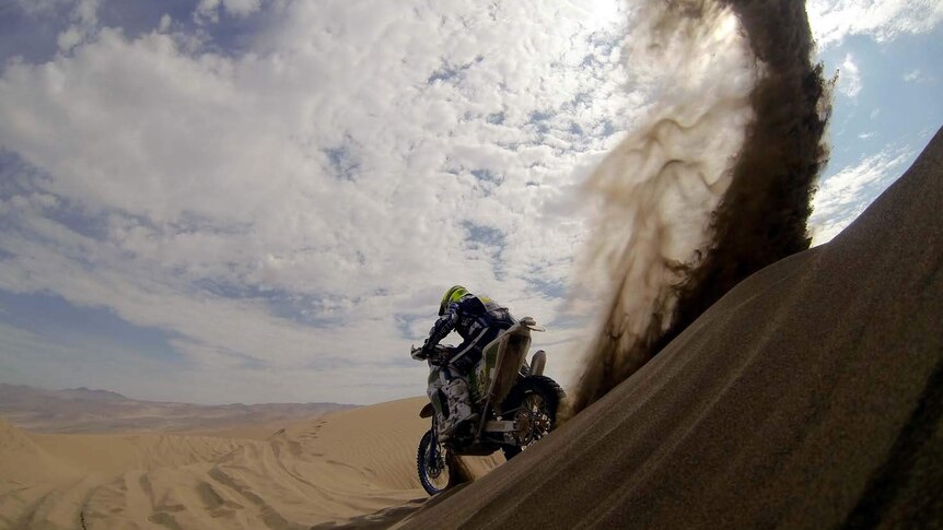 Alessandro Zanotti rides on a sand dune