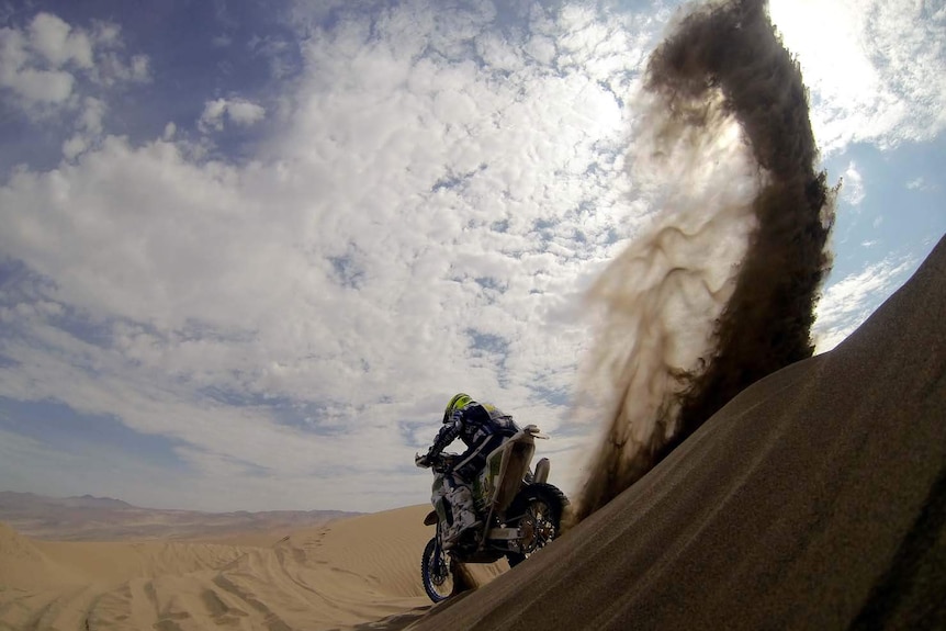 Alessandro Zanotti rides on a sand dune