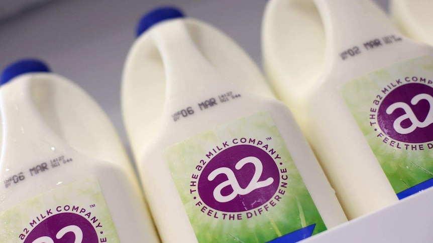 Bottles of A2 milk on a shelf.