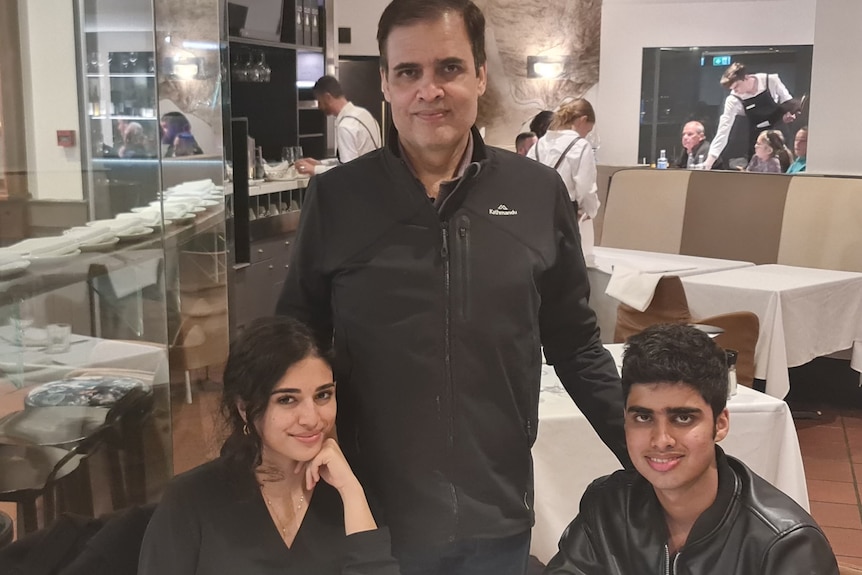 Dr Muhammad Hussain with his children at a restaurant