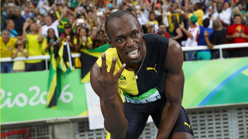 Bolt celebrates winning the Jamaican team's gold medal