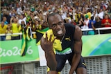 Bolt celebrates winning the Jamaican team's gold medal