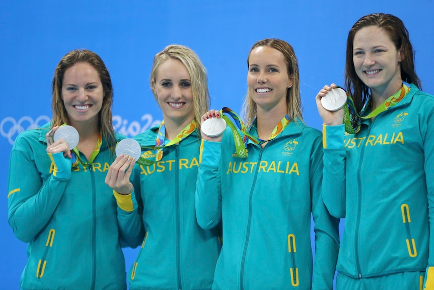 Four Australian swimmers pose with their silver medals at Rio Olympics.