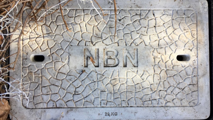 A concrete pit lid with NBN on it.