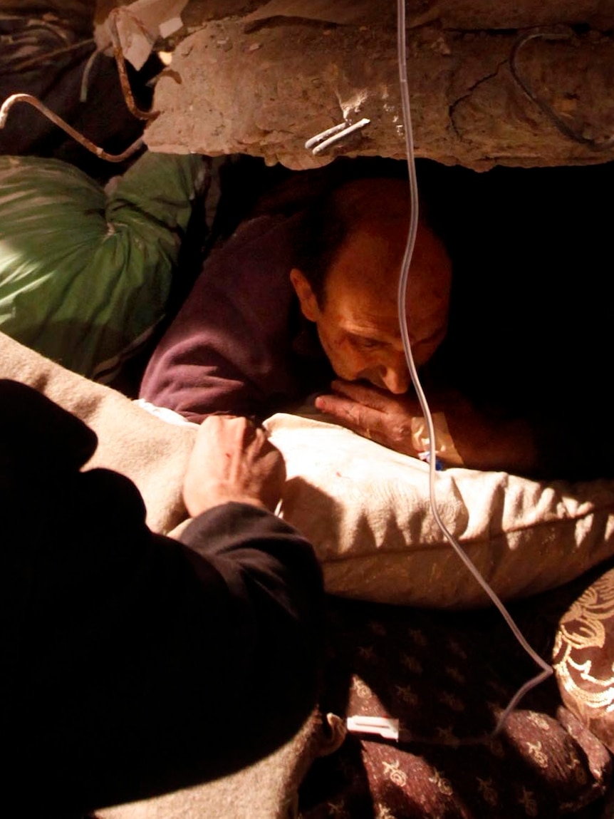 Survivor in a collapsed building in Ercis, near the eastern Turkish city of Van, after earthquake