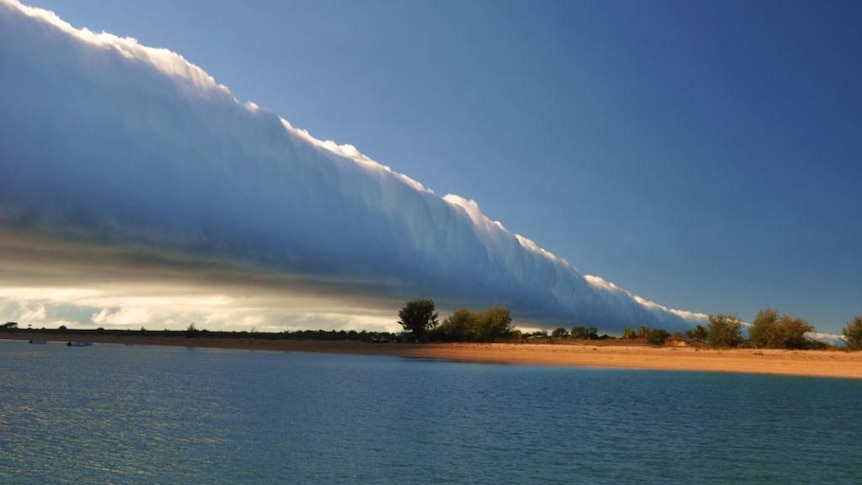 The morning glory cloud forms over Sweers Island.