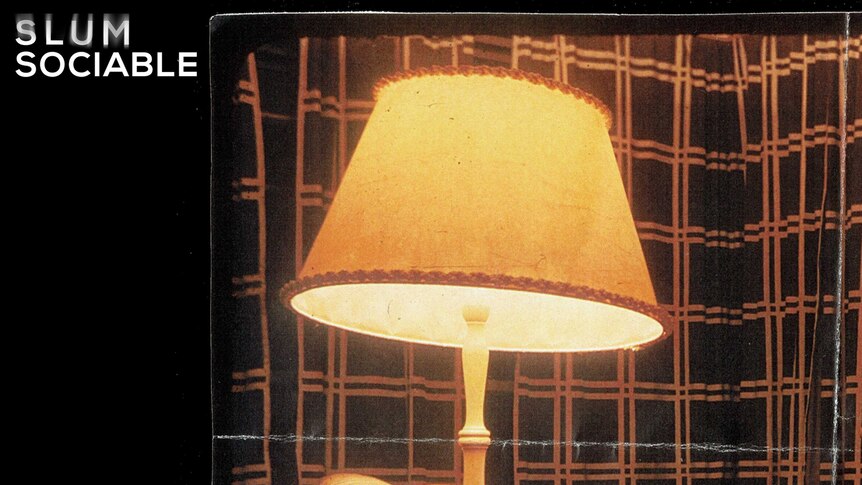 Front cover of Slum Sociable's self-titled album, featuring yellow lamp on black background