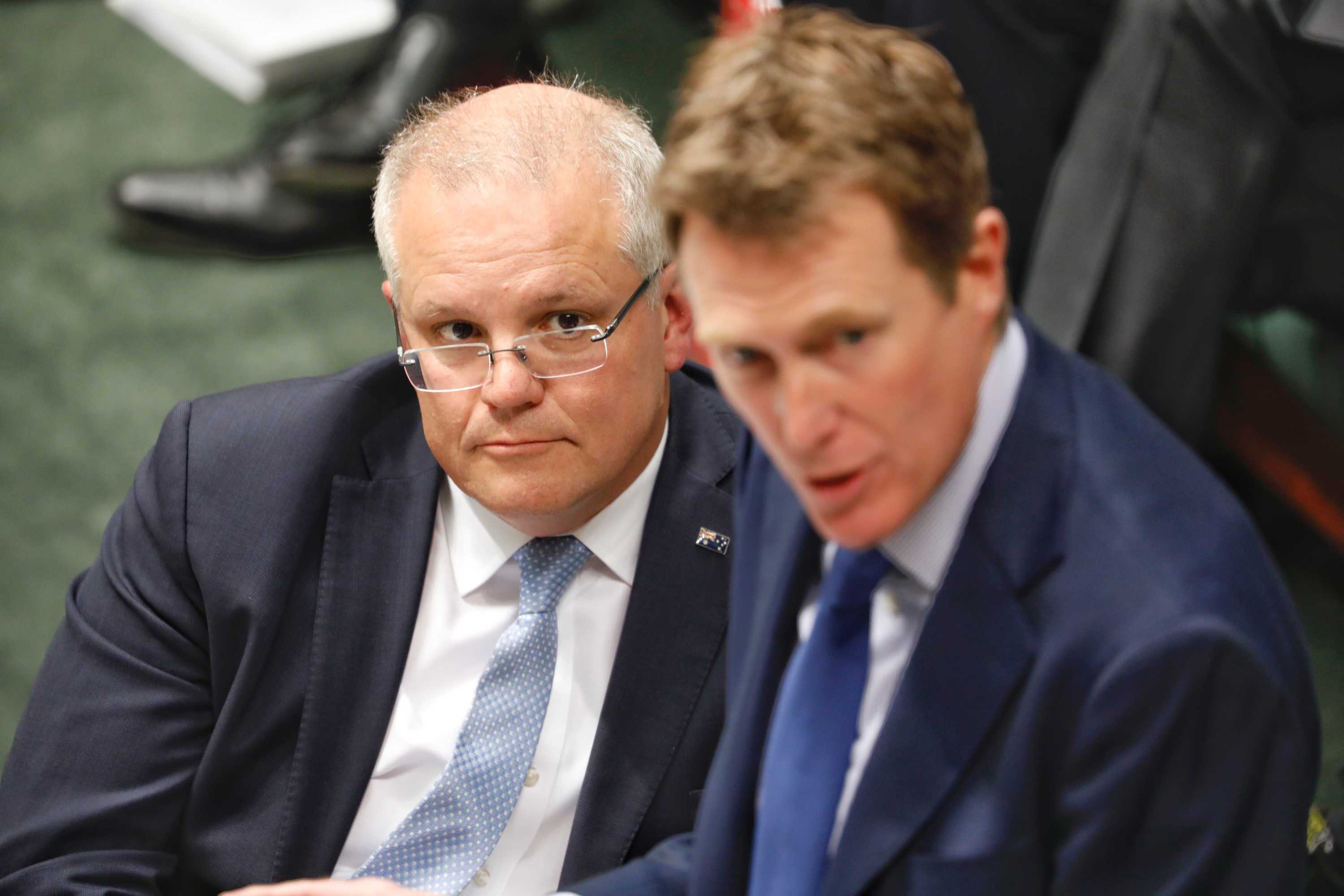 Scott Morrison watches on as Christian Porter speaks in the House of Representatives