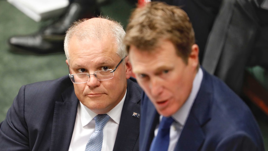 Scott Morrison watches on as Christian Porter speaks in the House of Representatives