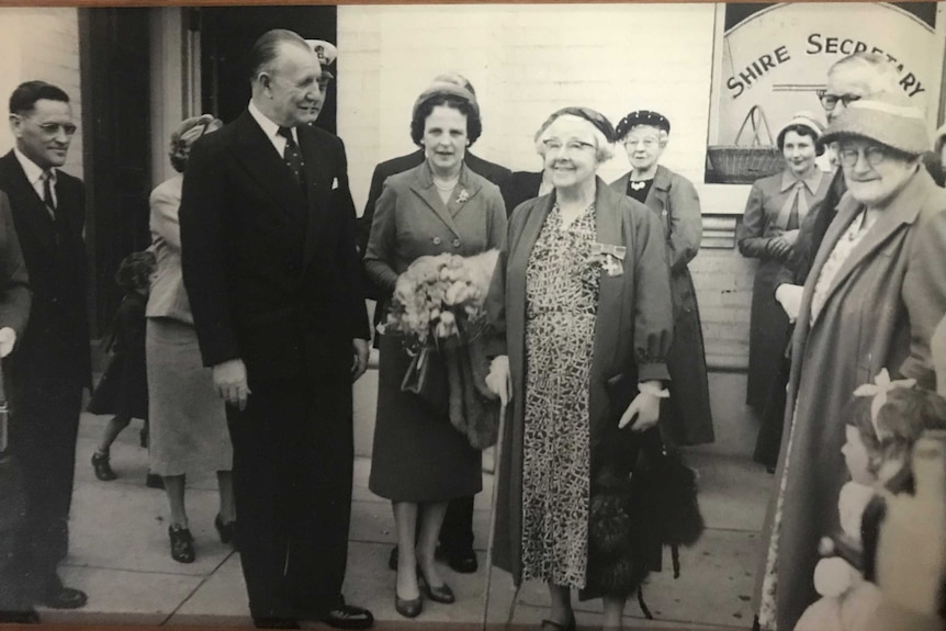 A black and white photo of a group of people.