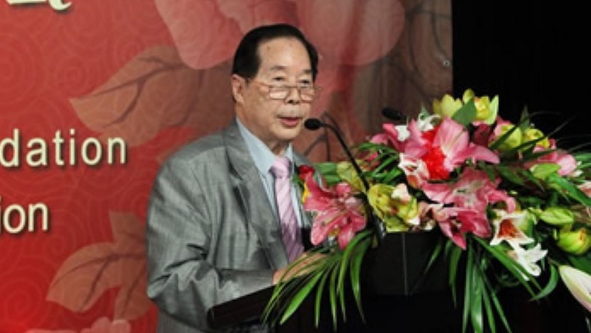 Man speaking at a podium.