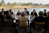 G20 leaders speak as they sit around a table on the outskirts of Bengaluru, India.