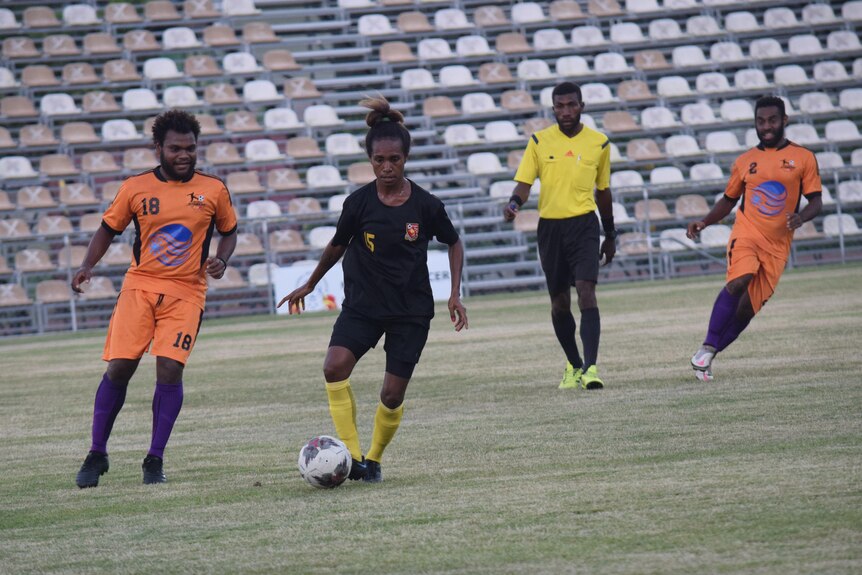 The PNG women's national football team play a friendly match against the PNG men's team.