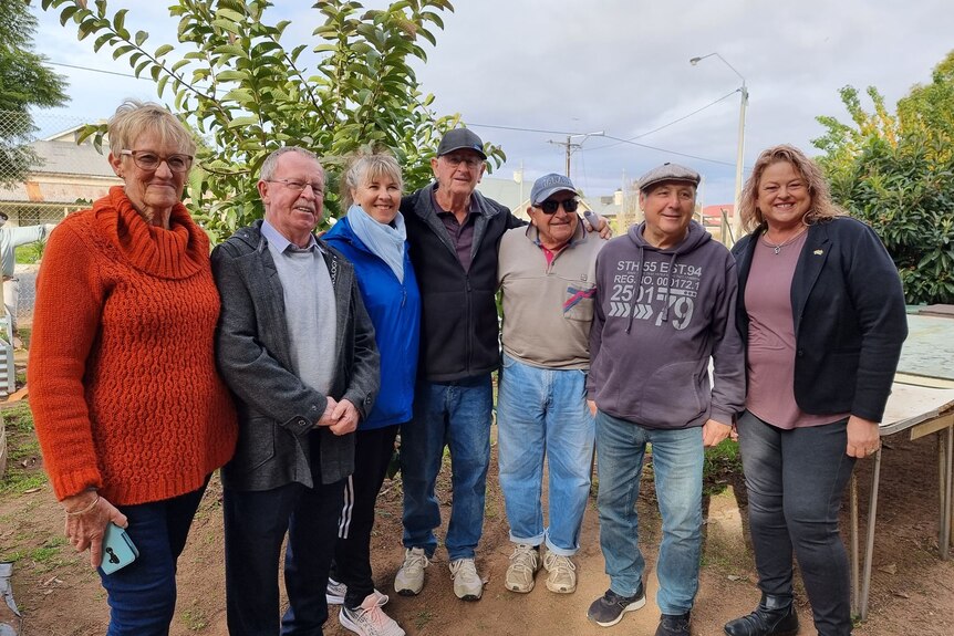 Members of the Port Pirie Community Garden stand with Human Services Minister Nat Cook and Member for Stuart Geoff Brock. 