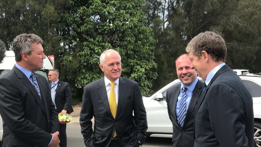 Prime Minister Malcolm Turnbull and Energy Minister Josh Frydenberg at Port Kembla Steelworks.