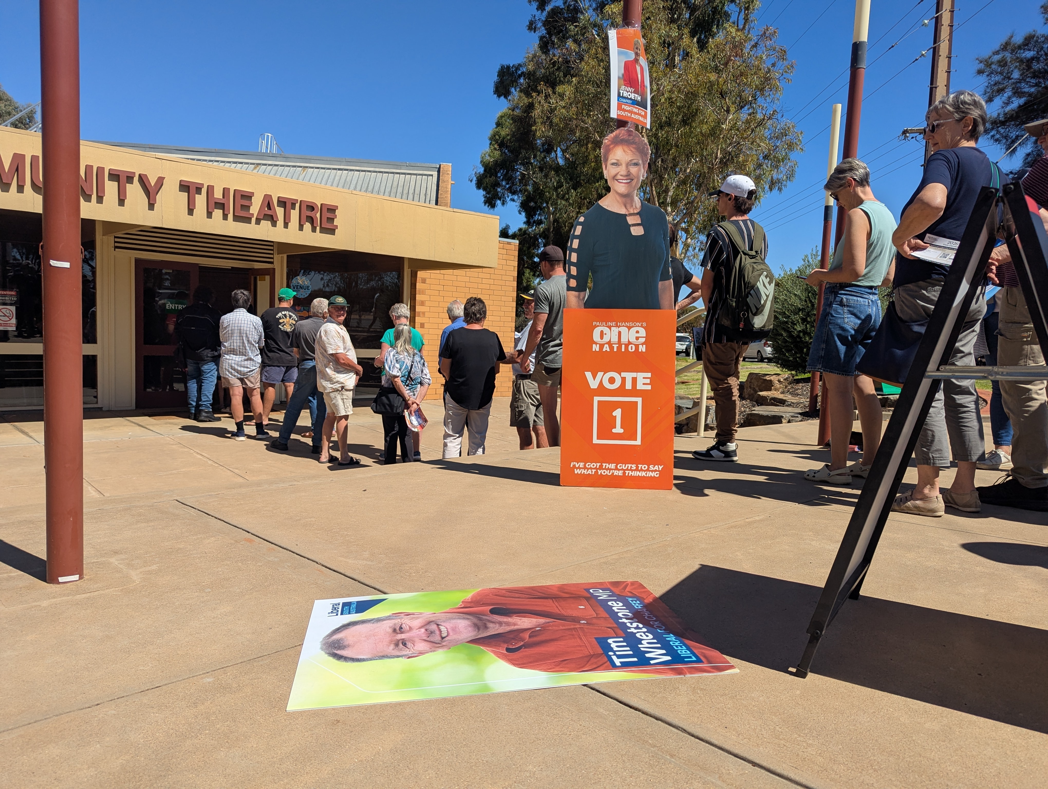People queue to vote at a high school in the March 2026 SA elections