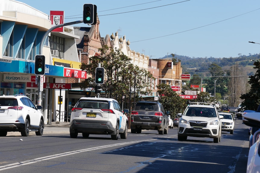 the main street of bega with cars and traffic lights