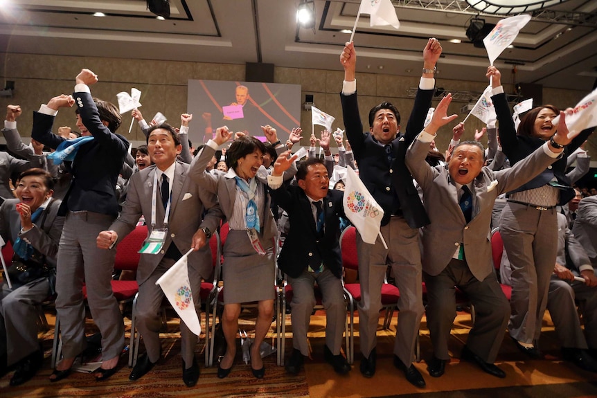 Moment of joy ... The Tokyo delegation celebrate the announcement of its successful bid