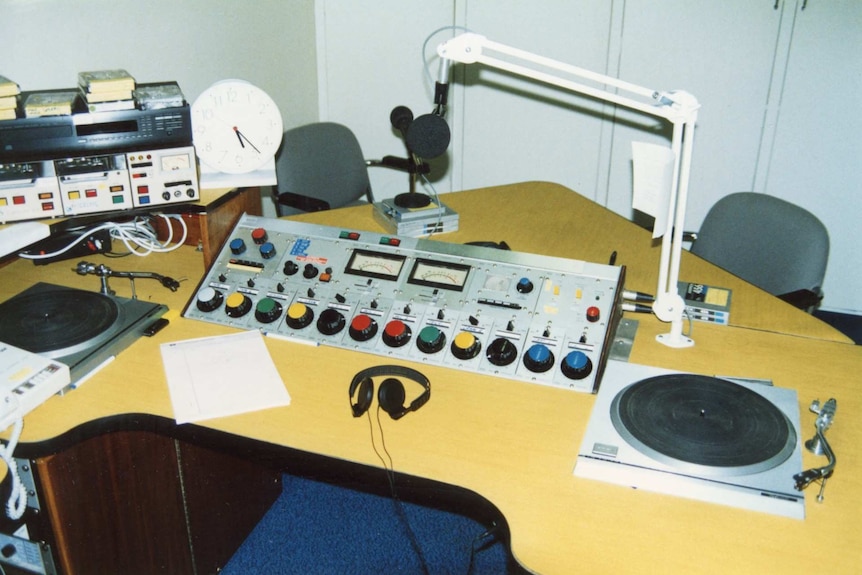 Old radio studio panel with dials and turntables.