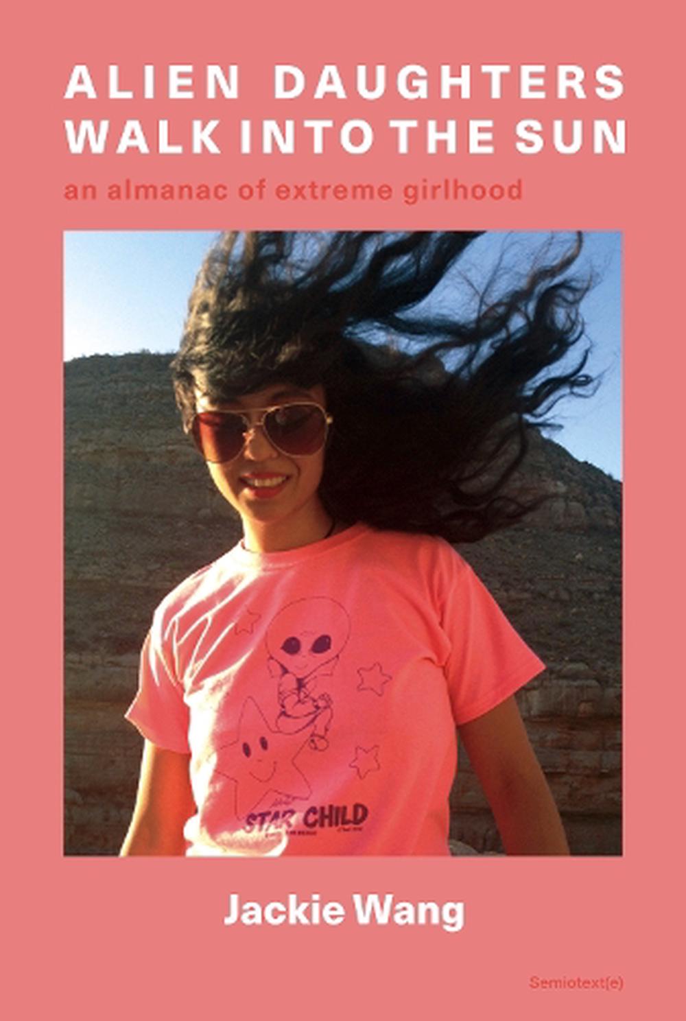 A book cover showing a photograph of a young Asian girl with windswept long black hair, wearing a pink shirt and sunglasses