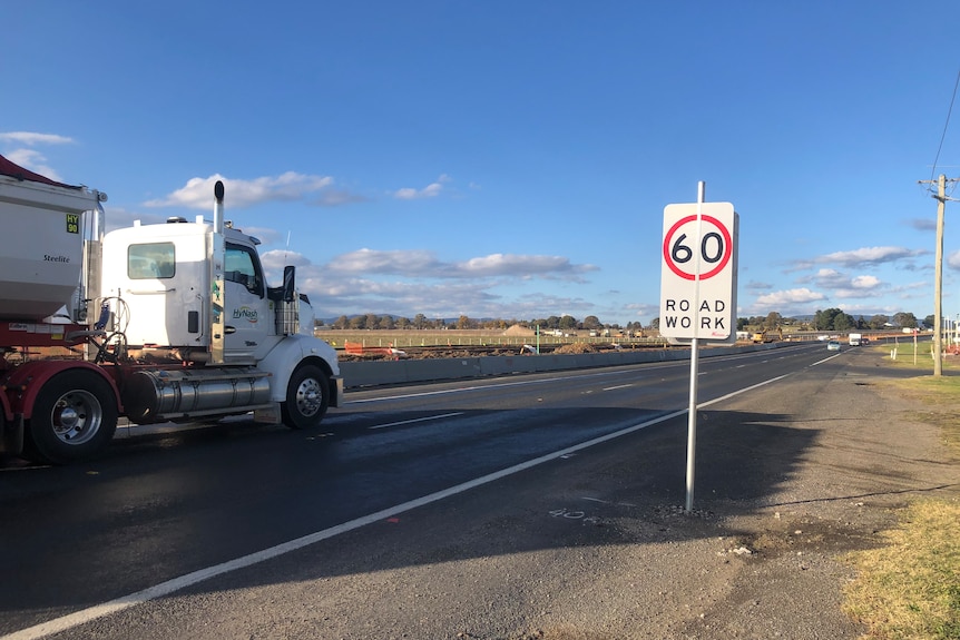 Truck drives through road works in Bathurst