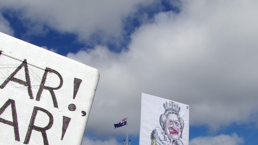 Protester with Julia Gillard wig and fake nose at anti-carbon tax protest