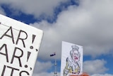 Protester with Julia Gillard wig and fake nose at anti-carbon tax protest