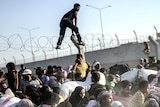 Fences don't halt fleeing Syrians