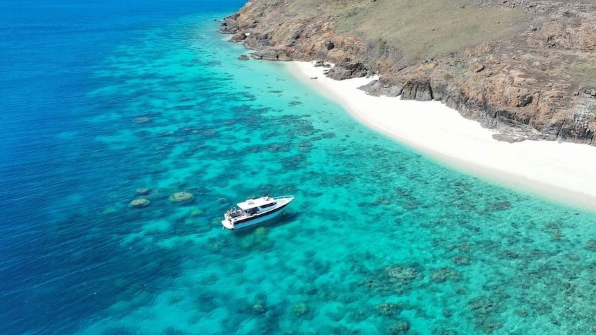 A boat on the Great Barrier Reef off Haggerstone Island