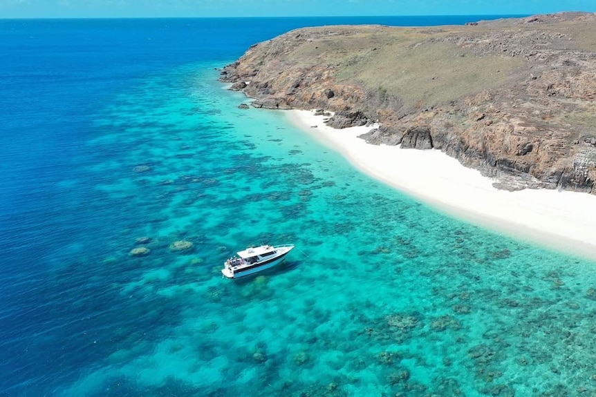 A boat on the Great Barrier Reef off Haggerstone Island