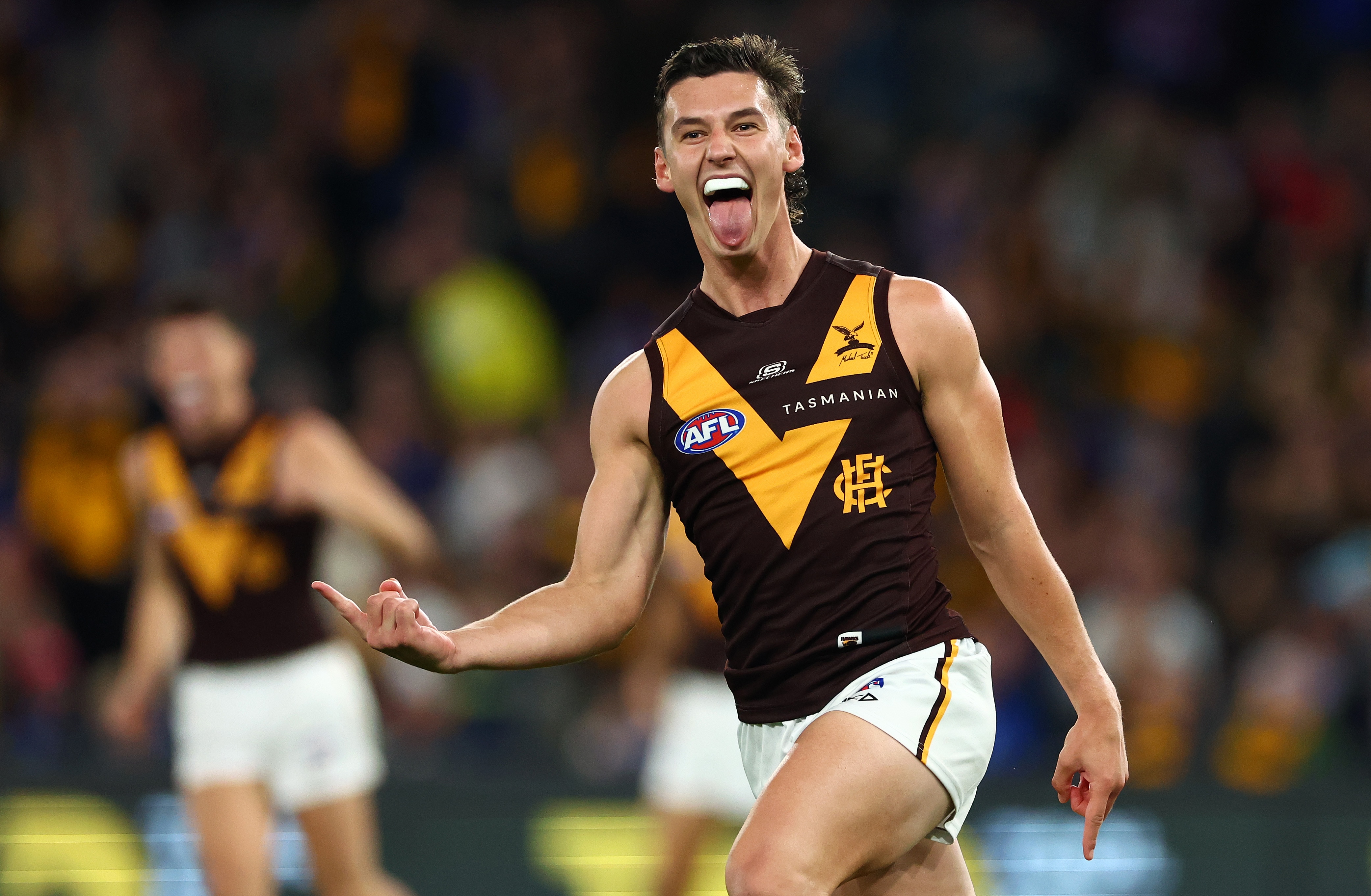 Connor Macdonald celebrates a goal in the AFL