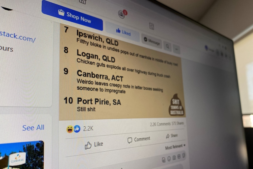 A photo of a computer screen displaying the Shit Towns of Australia Facebook page.