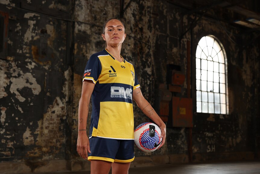 Central Coast Mariners soccer player Kyah Simon wearing her team's 