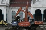 Tsunami aftermath: clean-up has begun in Aceh but the Indonesian Government warns it may take months.