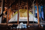 tent set up inside home without walls