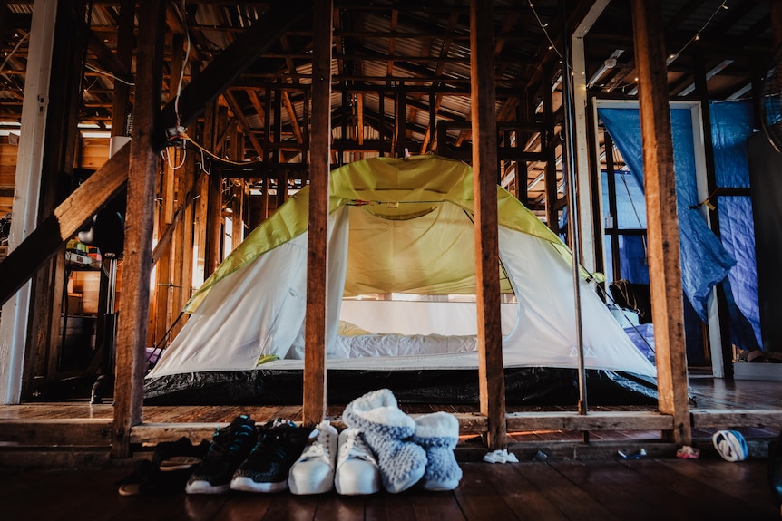 tent set up inside home without walls