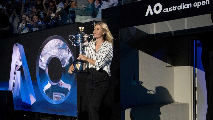 Maria Sharapova holds the Australian Open trophy at the 2018 draw
