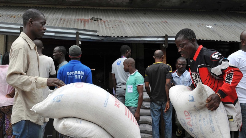 Liberian residents receive food rations following Ebola outbreak