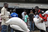 Liberian residents receive food rations following Ebola outbreak