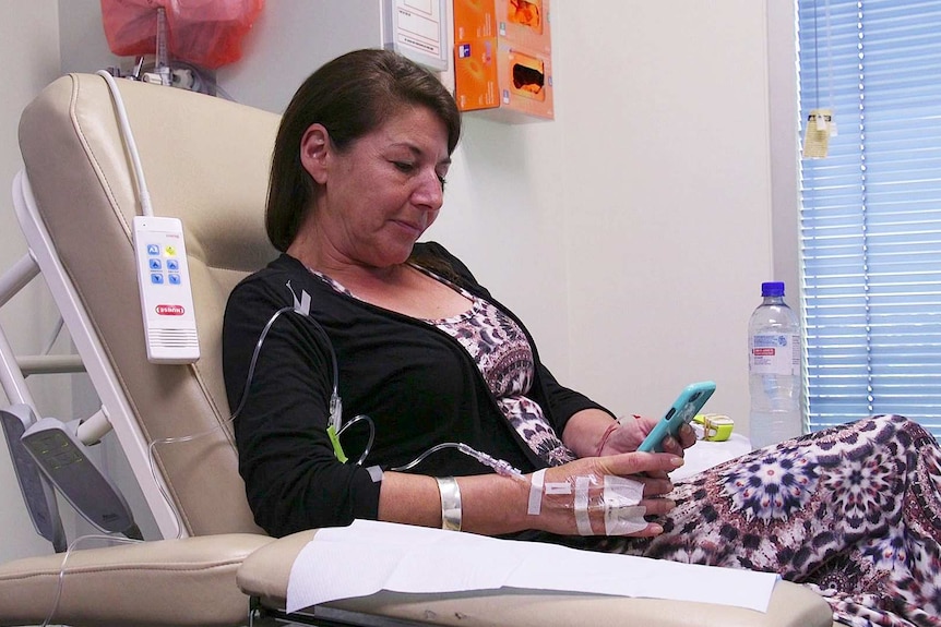 Halouma Pittock in hospital with a tube in her arm.