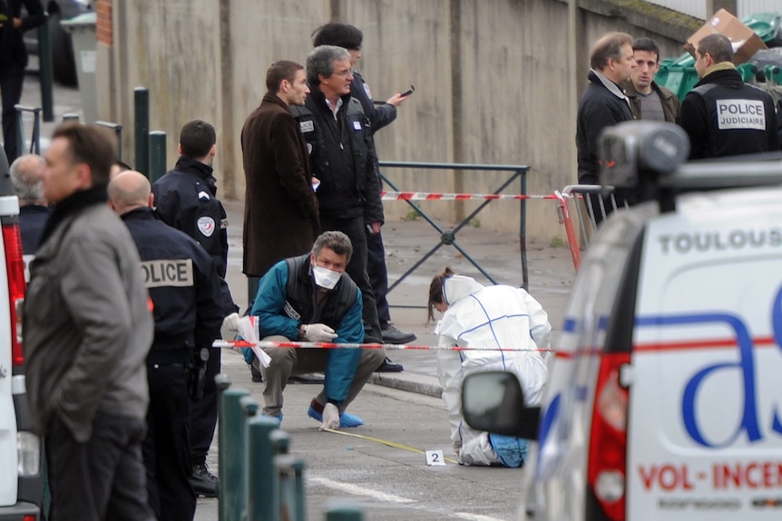 Police inspect the scene of the French school shooting