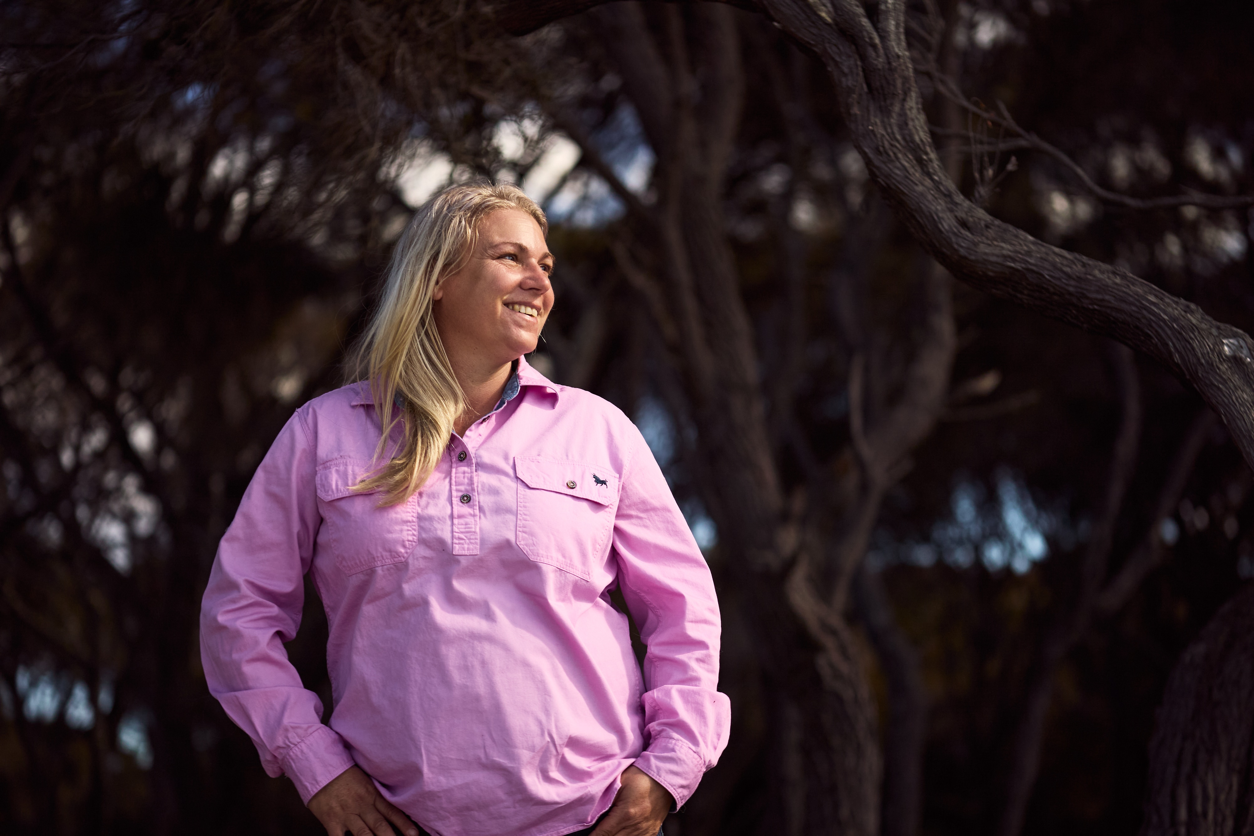 Amy Vickers wearing a mauve shirt looking off to the side.
