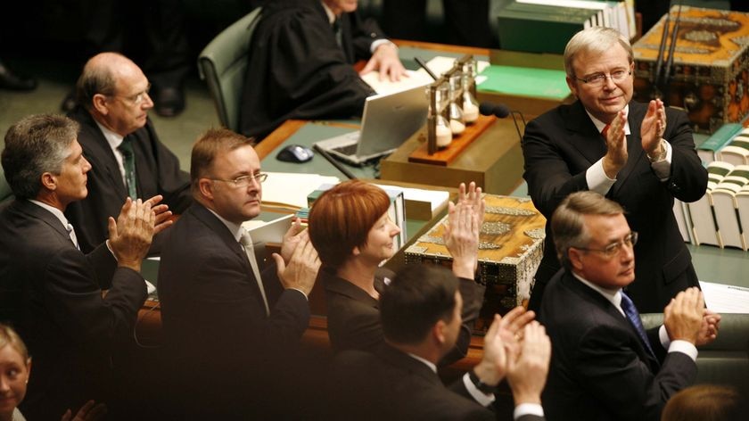 Kevin Rudd applauds Indigenous people in Parliament.