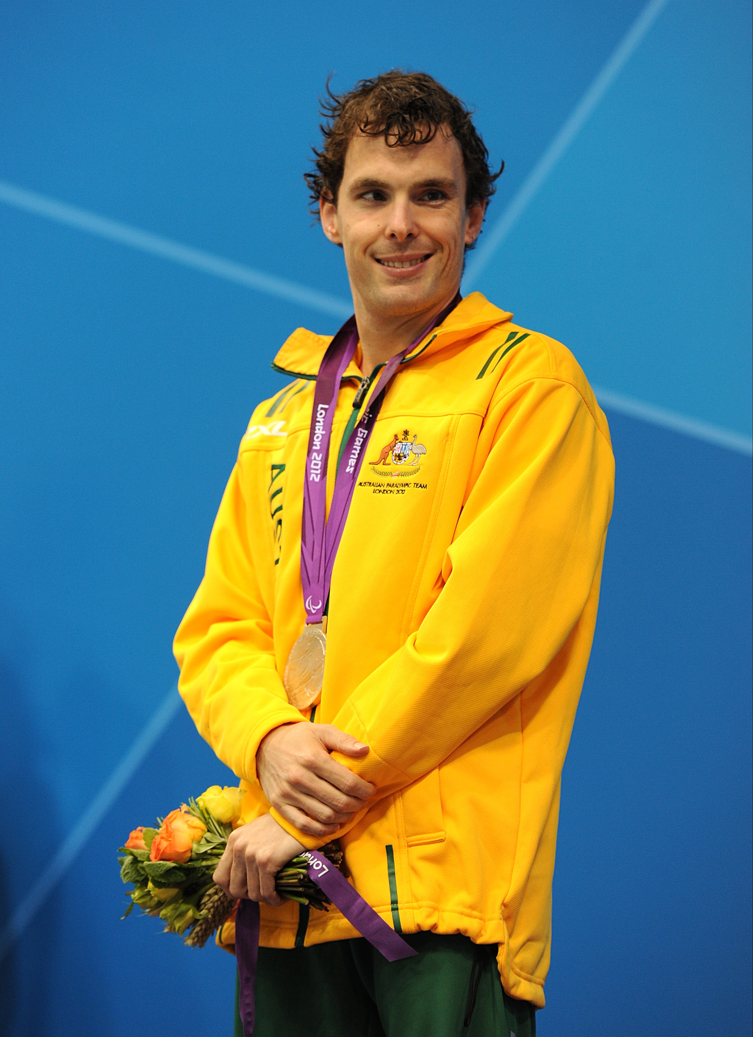 Matthew Levy on the podium with his silver medal.