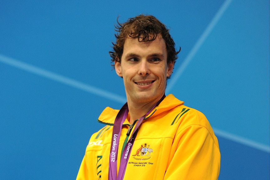Matthew Levy on the podium with his silver medal.