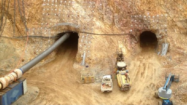 Mining equipment and vehicles working at Pacific Niugini's gold mine near Halls Creek.